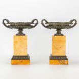 A pair of cassolettes in neoclassical style, made of bronze and mounted on a marble base.
