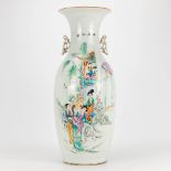 A vase made of Chinese porcelain and decorated with ladies and children.