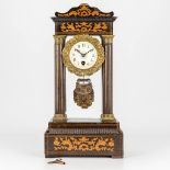 A column clock made of wood and mounted with bronze and finished with marquetry inlay