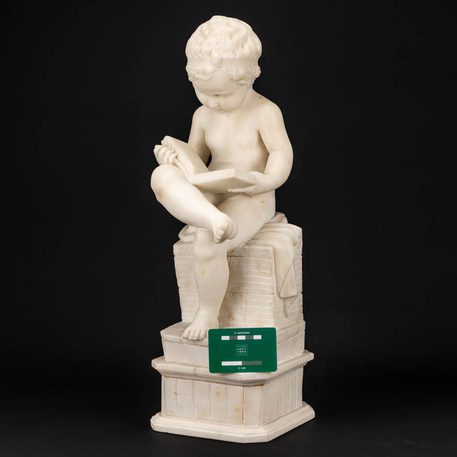 A statue of a reading boy made of alabaster. - Image 2 of 11