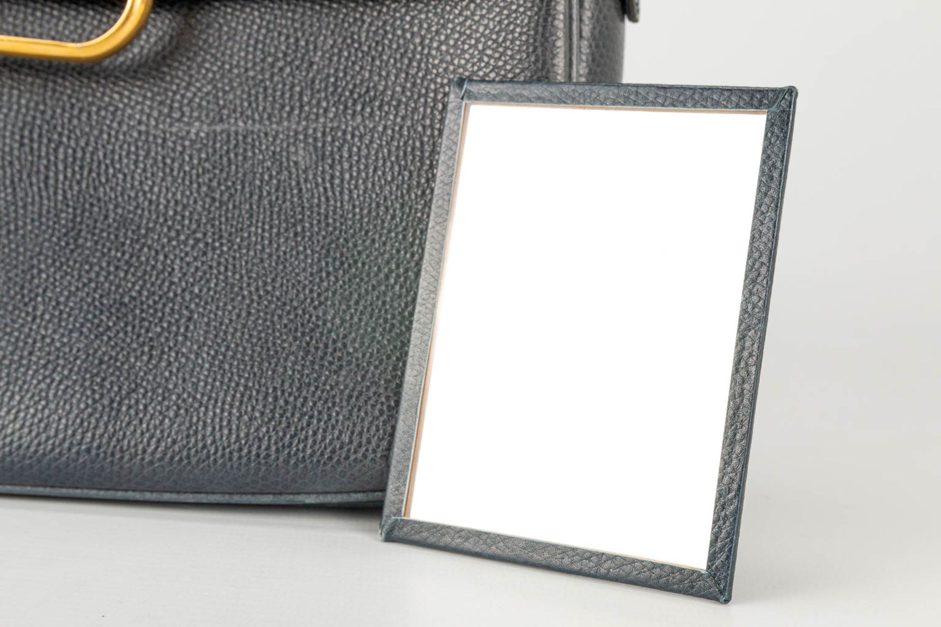 A purse made of black leather and marked Delvaux, with the original mirror. - Image 6 of 13