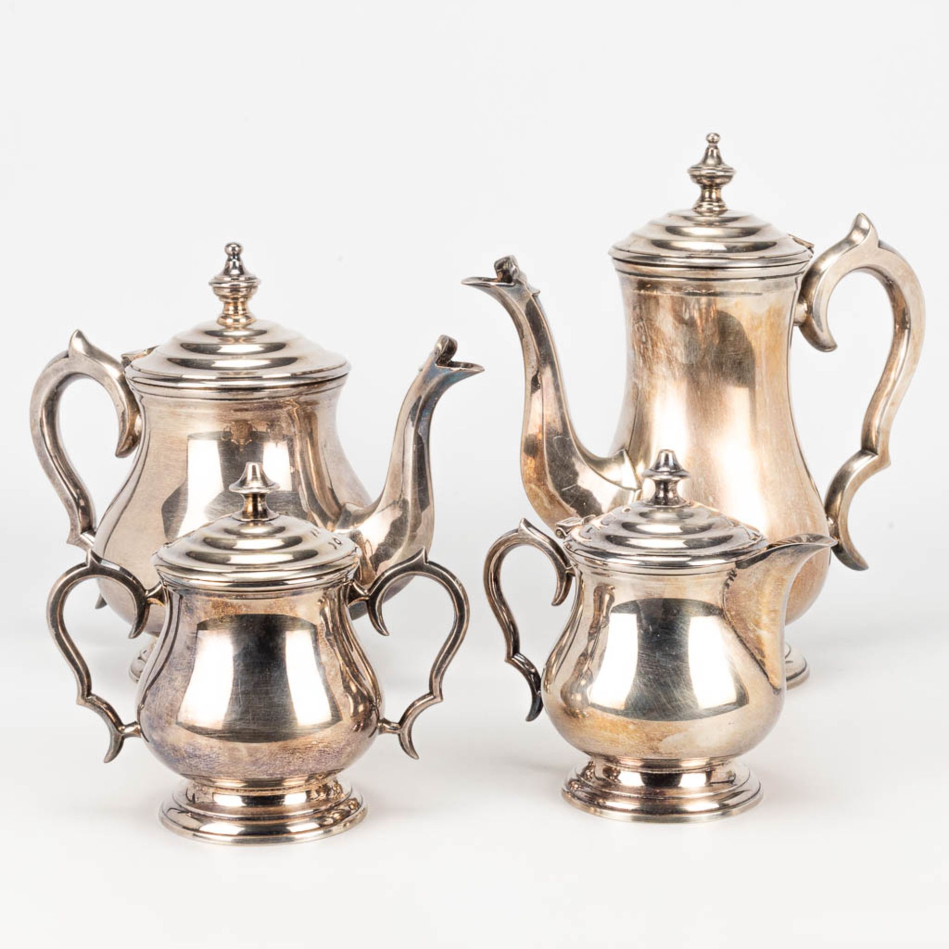 A coffee and tea service made of silver-plated metal.