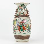 A Nanking vase made of Chinese porcleain and decorated with warriors