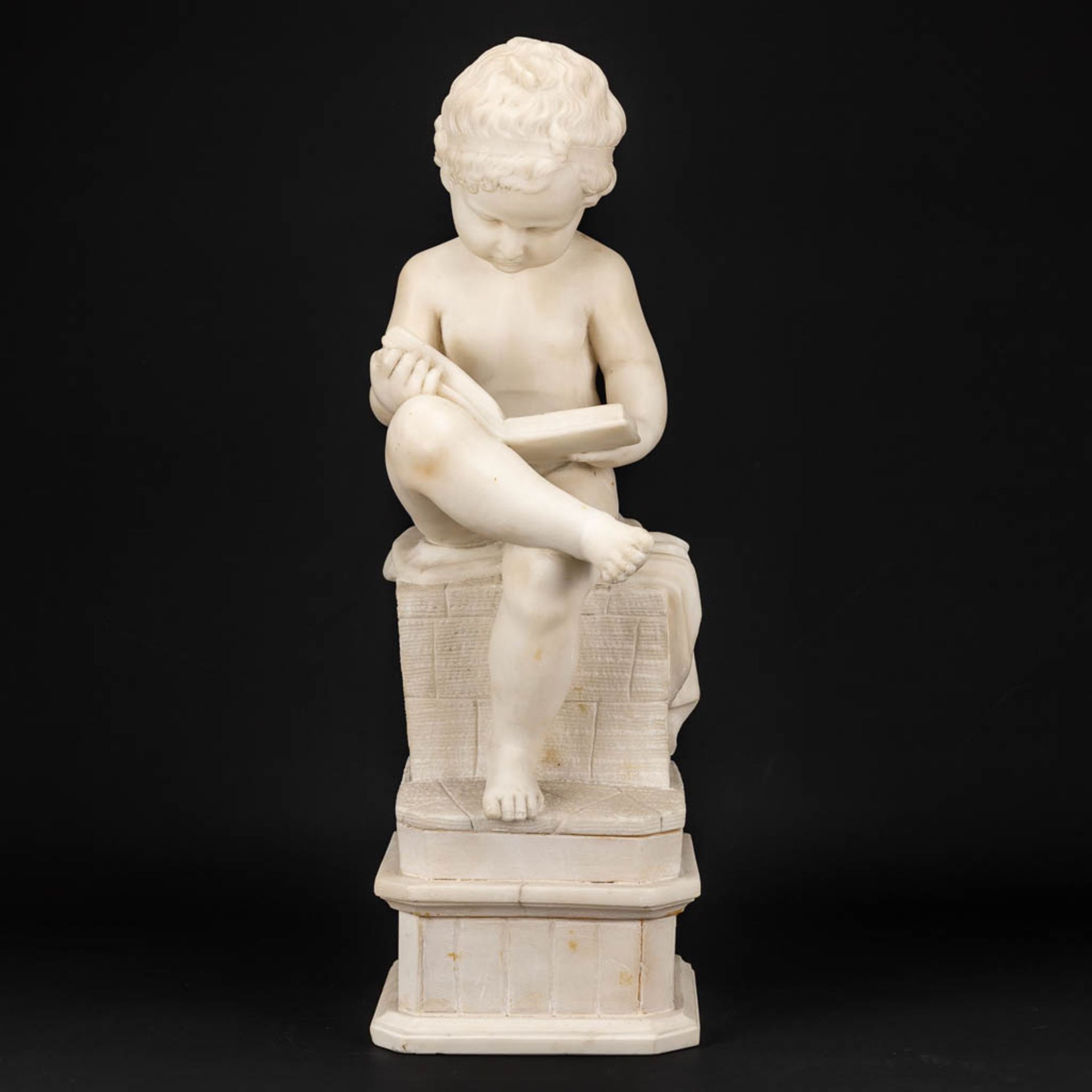 A statue of a reading boy made of alabaster. - Image 3 of 11