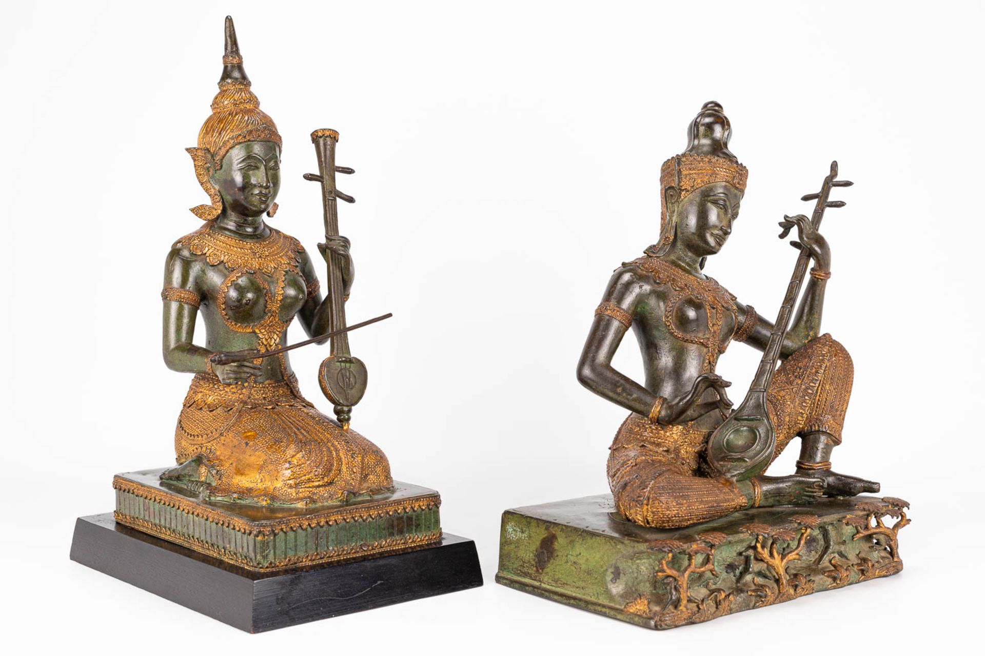 A collection of 2 oriental musical buddha's, made of metal. - Image 10 of 15