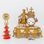 A table clock made of spelter and onyx and an Italian clock made of ceramics and brass.
