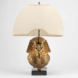A table lamp with a Tutankhamun death mask, made by Deknudt.