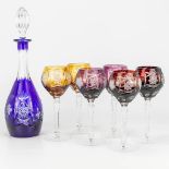 A carafe and 6 glasses made of colored. cut crystal and marked Artisanat de Lorraine.