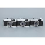 Three Olympus Trip 35 Compact Cameras