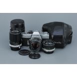 A Minolta SRT 101 SLR Camera,