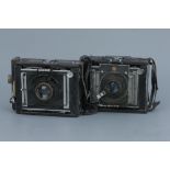 Two Van Neck Press Cameras,