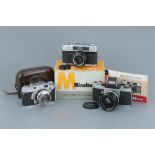 Three 35mm Film Cameras,