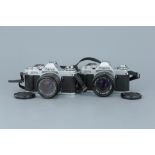 Two Canon AV-1 SLR Cameras