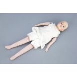An Unmarked Bisque Doll,