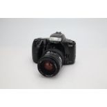 A Minolta Dynax 300si 35mm SLR Camera,