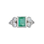 An Art Deco emerald and diamond ring.