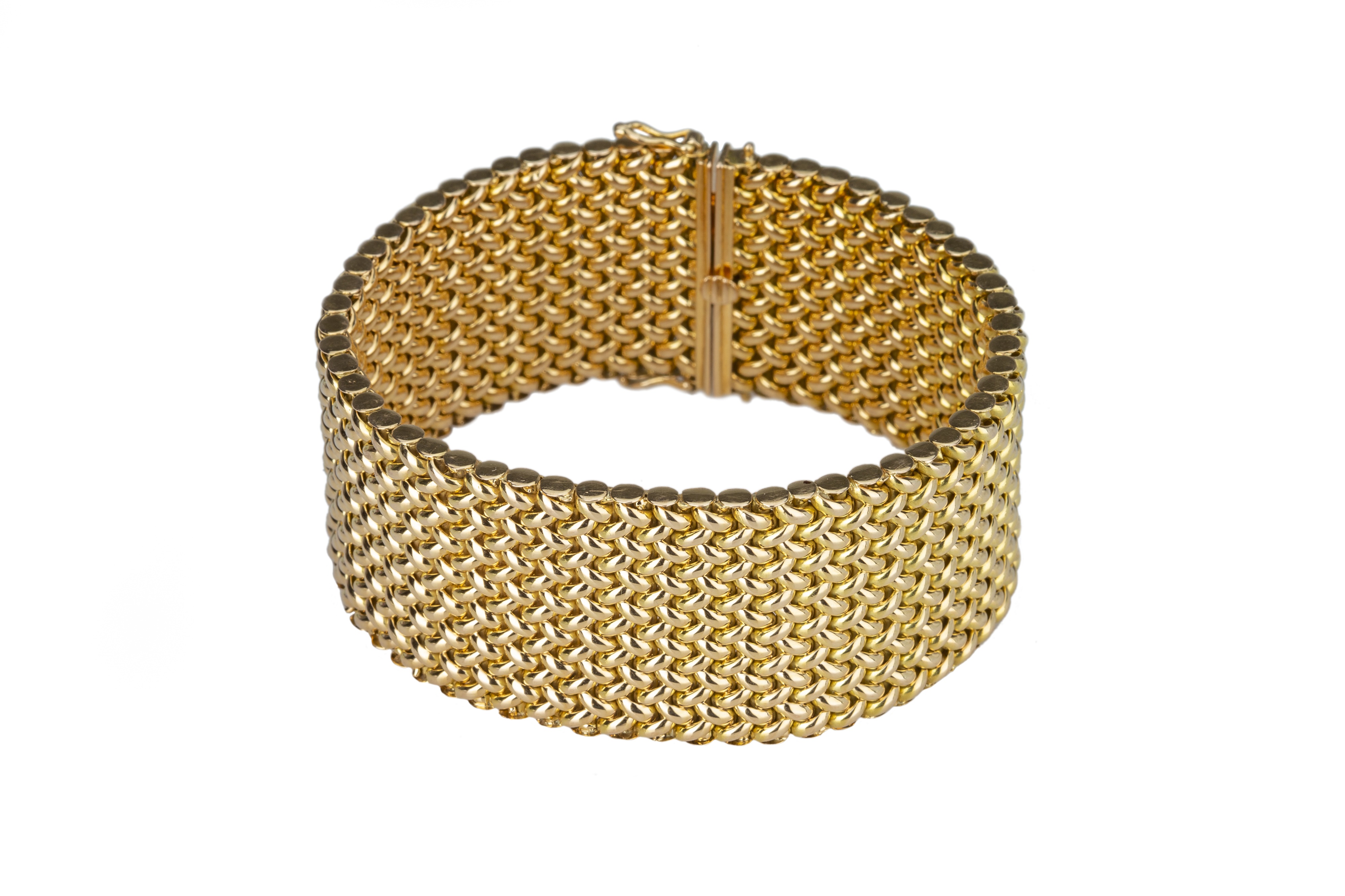 A bold and heavy gold weave link bracelet.