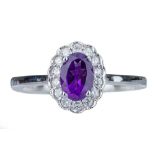 An amethyst and diamond cluster ring.