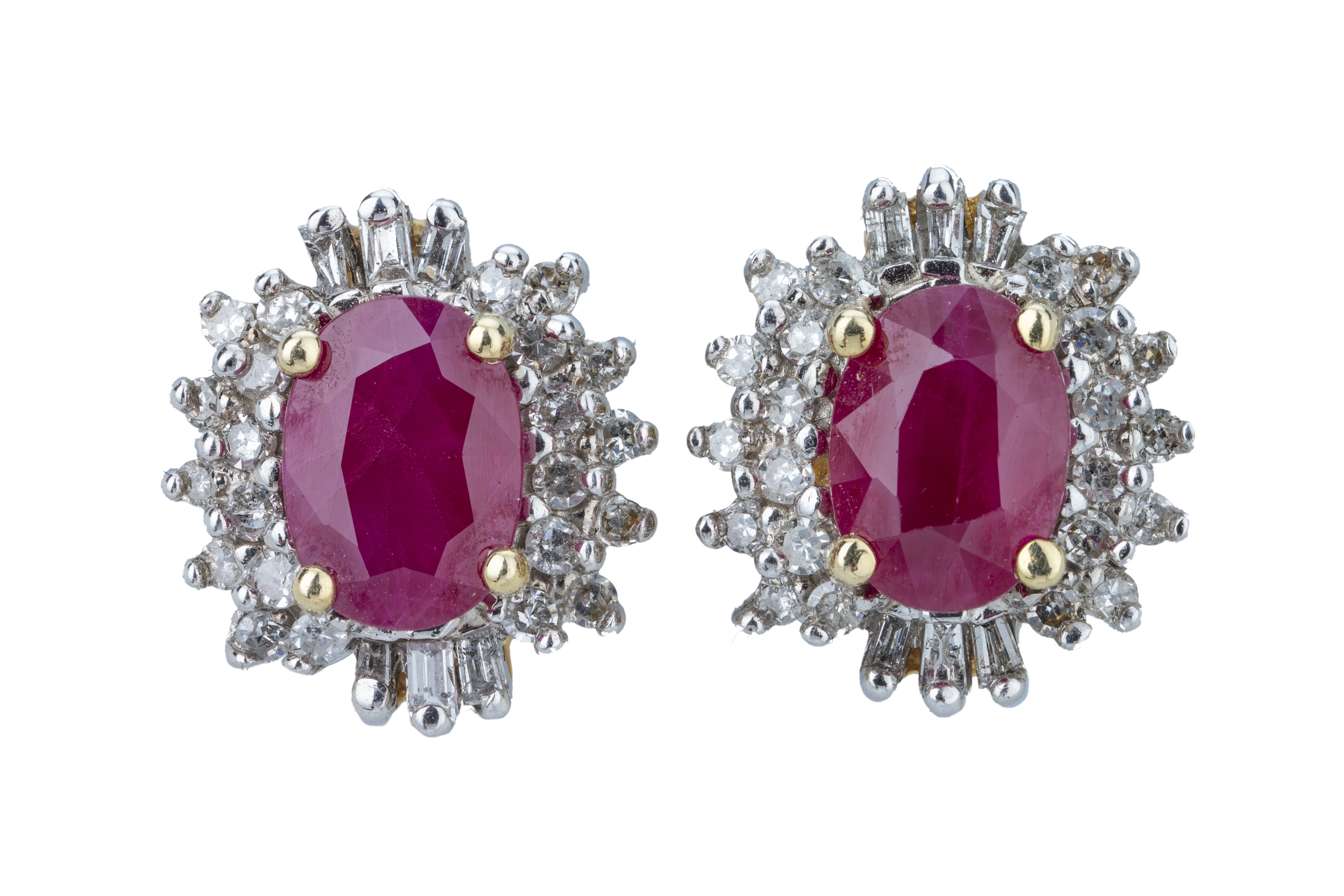 A pair of ruby and diamond ear studs.