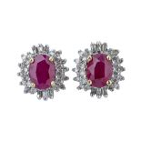 A pair of ruby and diamond ear studs.