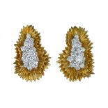 A spectacular pair of yellow gold and diamond ear clips.