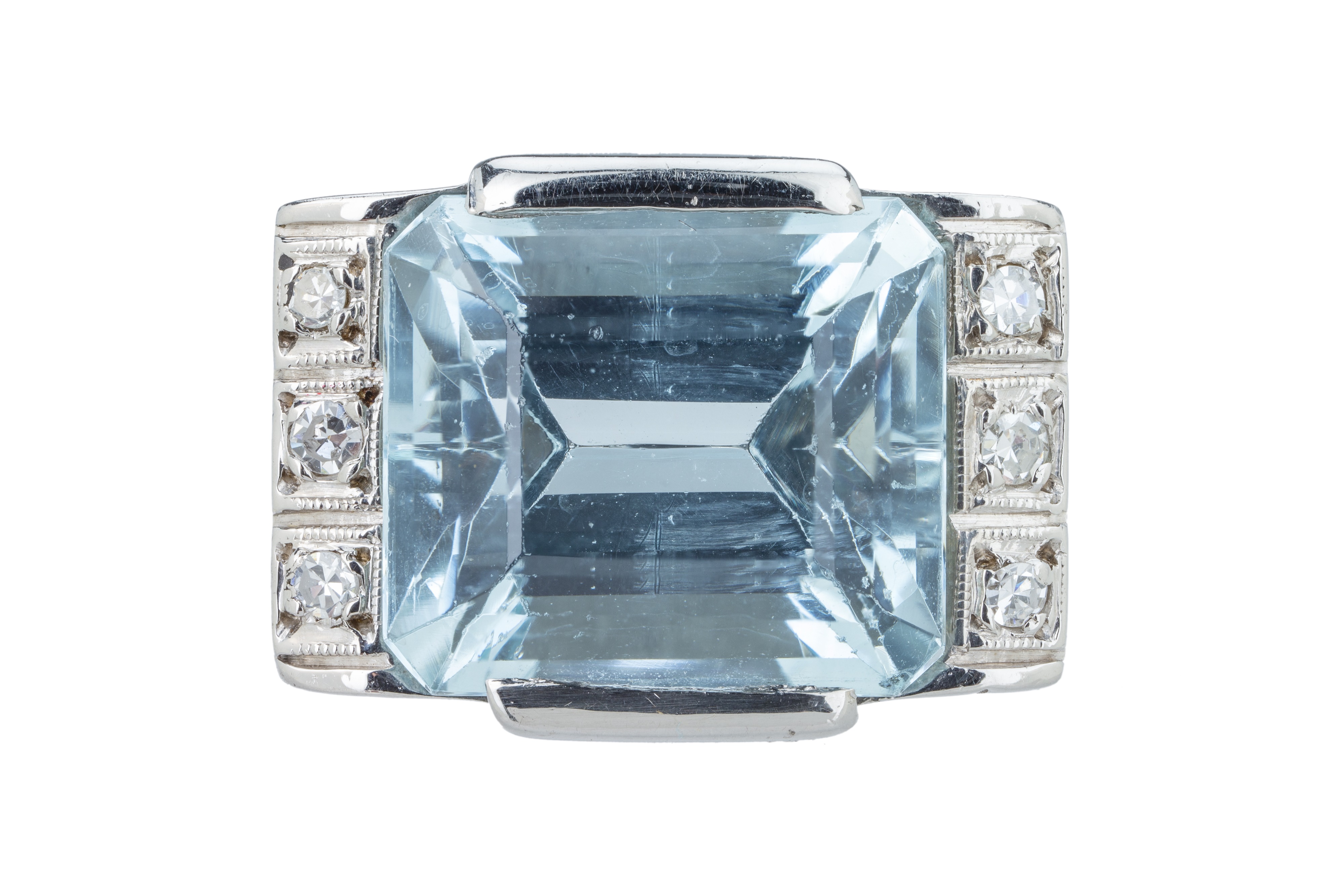 An Art Deco aquamarine and diamond dress ring.