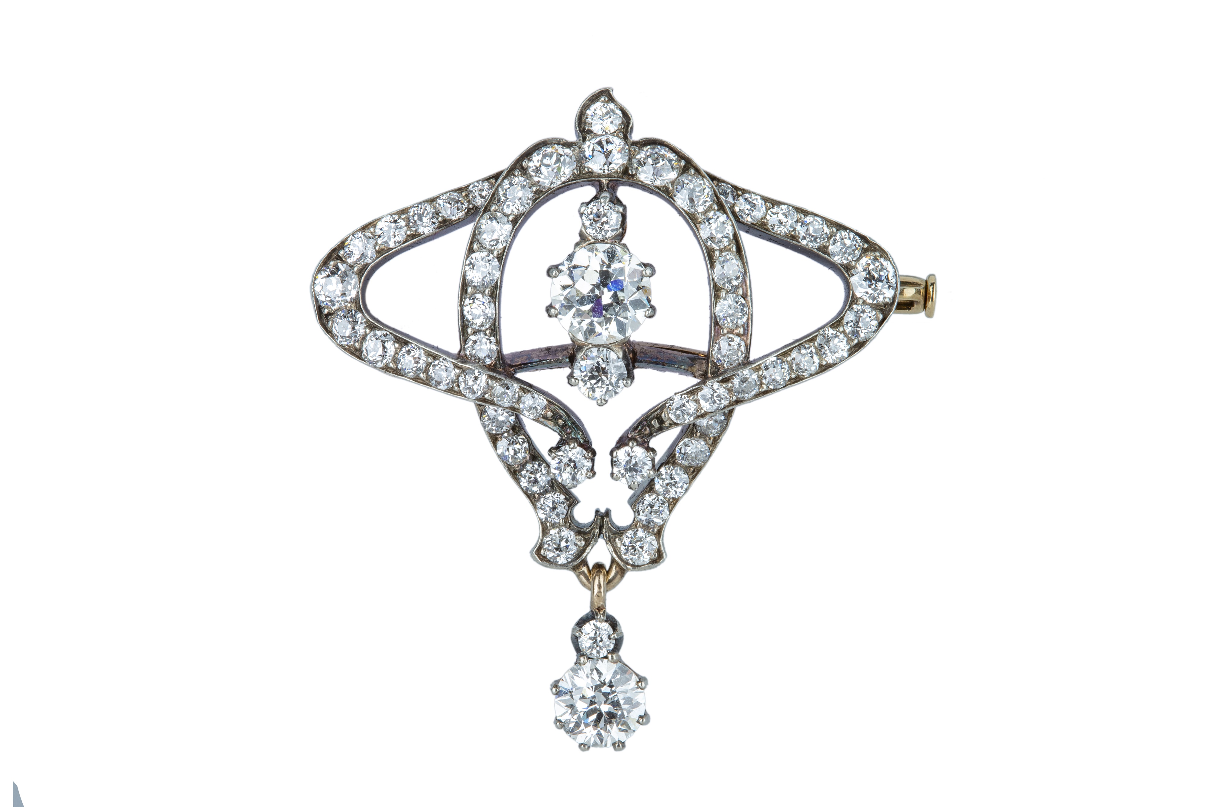 A late 19th century French diamond scroll brooch.