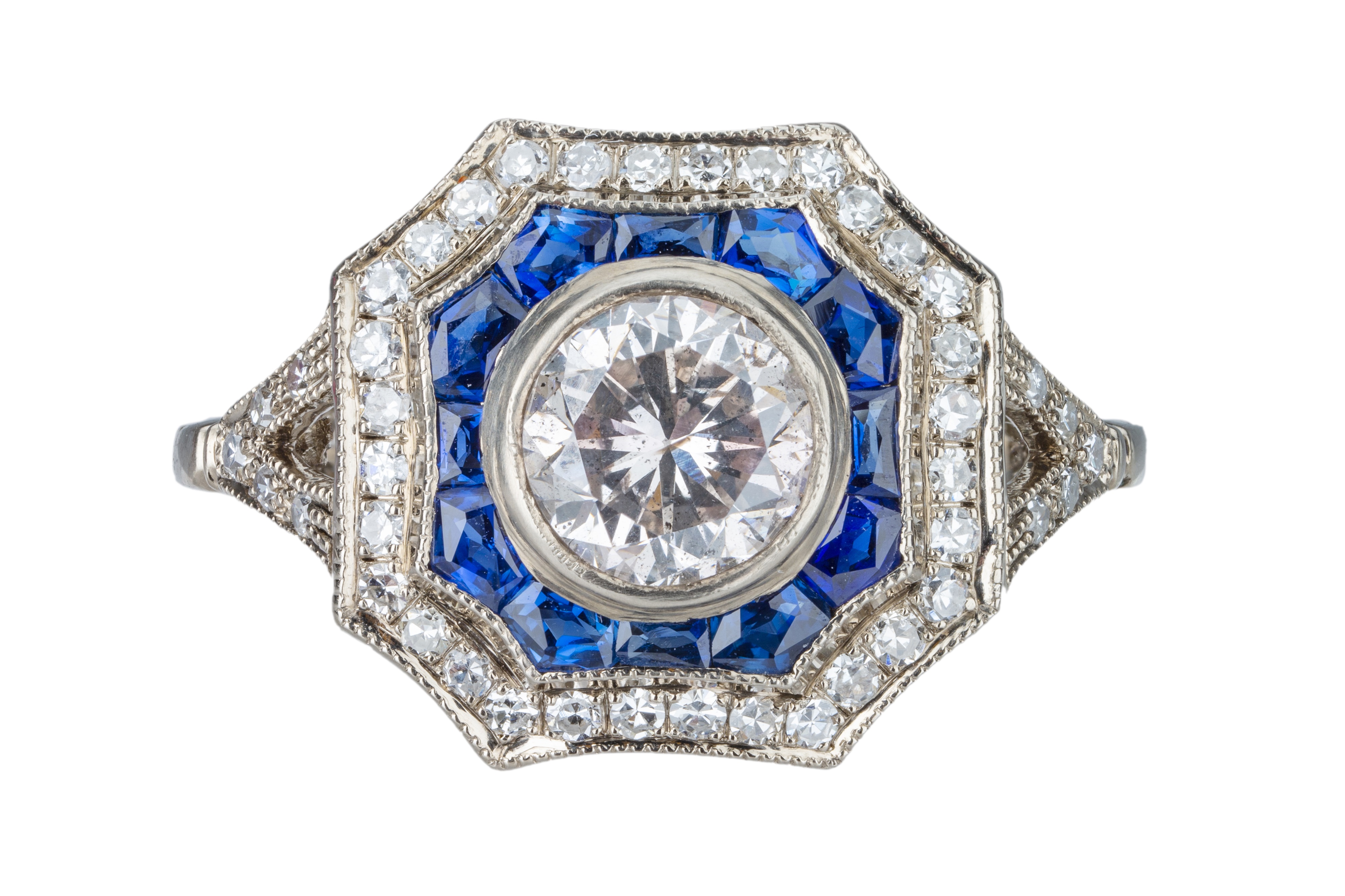 An Art Deco diamond and sapphire target cluster ring.