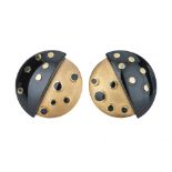 MORSE BROS. A pair of 1960s yellow gold and black enamel earrings.