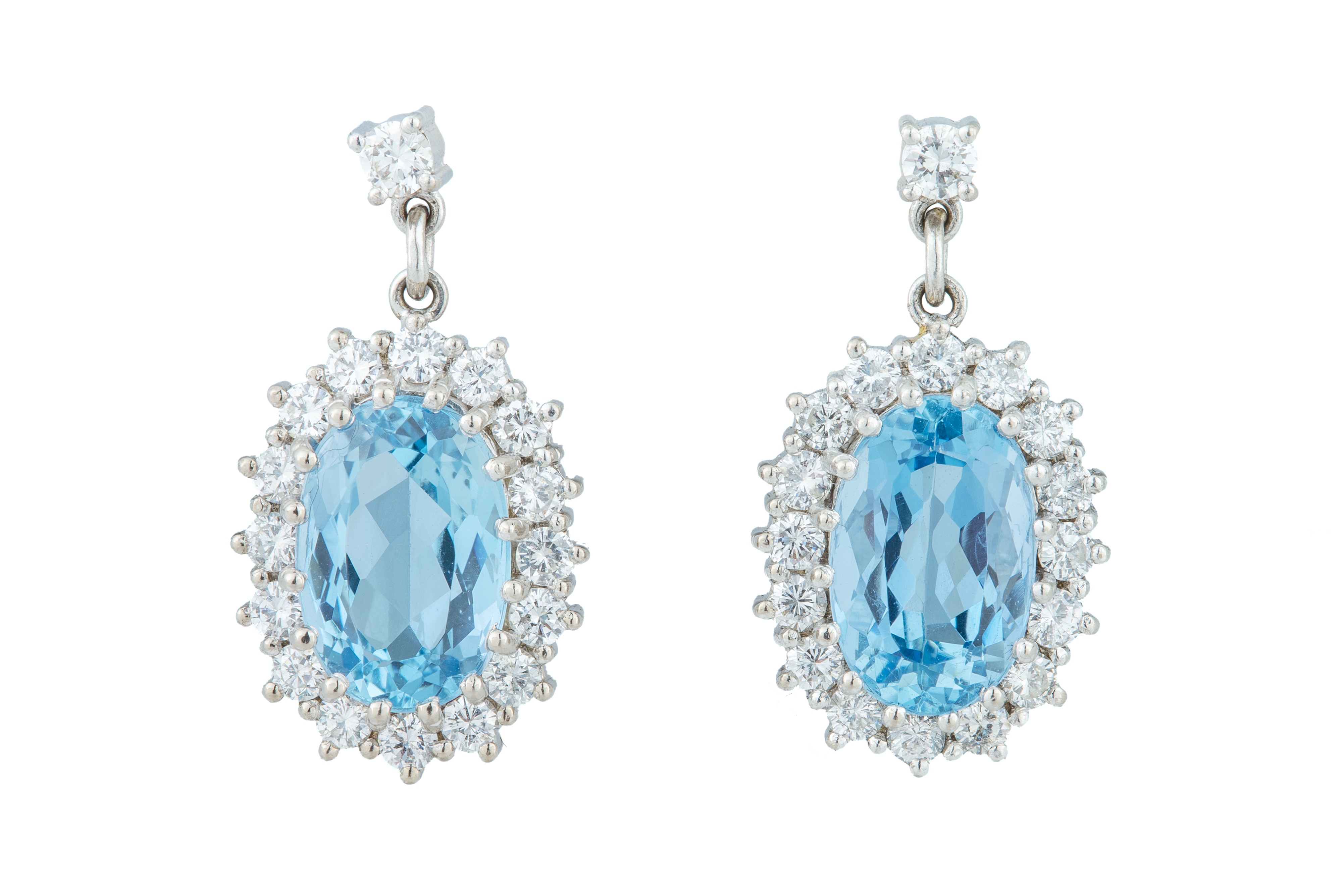 A pair of aquamarine and diamond earrings.