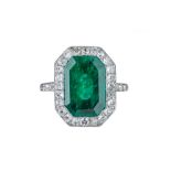 An Edwardian emerald and diamond ring.