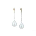 A pair of asymmetrical baroque pearl earrings.