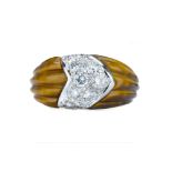 BEN ROSENFELD. A 1950s tigers eye and diamond ring.