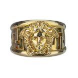 VERSACE. An 18 carat gold band,