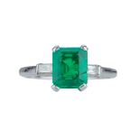 A vibrant Art Deco emerald and diamond ring.