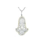 A delicate Art Deco diamond and seed pearl pendant.