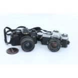 Two Minolta SLR Cameras,