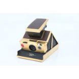 A Polaroid Land Camera SX-70 Alpha 1,