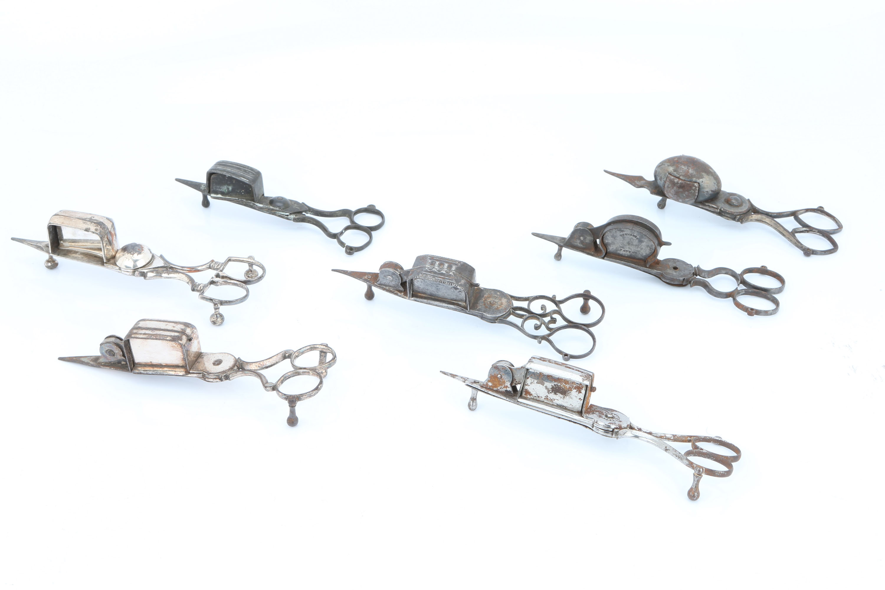 Seven Distressed Candle Snuffers,