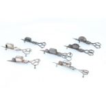 Seven Distressed Candle Snuffers,