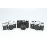 * Three SLR Cameras,