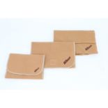 Three Nikon Brown Soft Pouches,