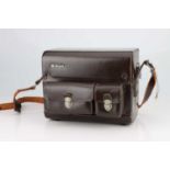 A Nikon Brown Leather Outfit Case,