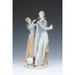 A Lladro Figure of a Gentleman & Lady,