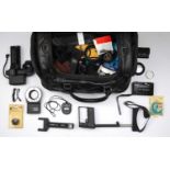 A Black Leather Camera Bag Filled With Accessories,