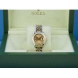 ROLEX. Oyster Perpetual 'DateJust'. A lady's yellow gold and steel wristwatch.