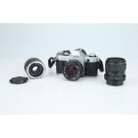 A Canon AE-1 35mm SLR Camera Outfit,