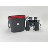 A Pair of Cased Chinon 12x50 Binoculars,