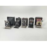 A Selection of Five Folding Cameras,