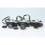 Three 35mm SLR Cameras,